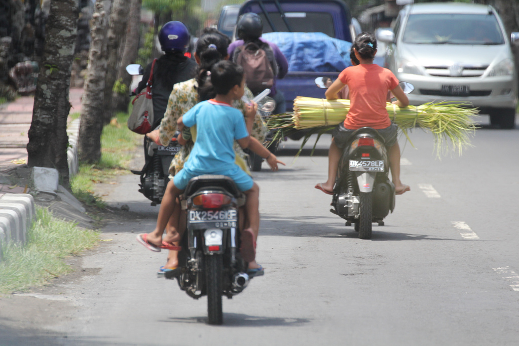 People-travelling-on-Scooters-Motorbikes-Bali-Indonesia